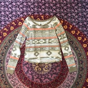 White tan and brown small pullover shirt.